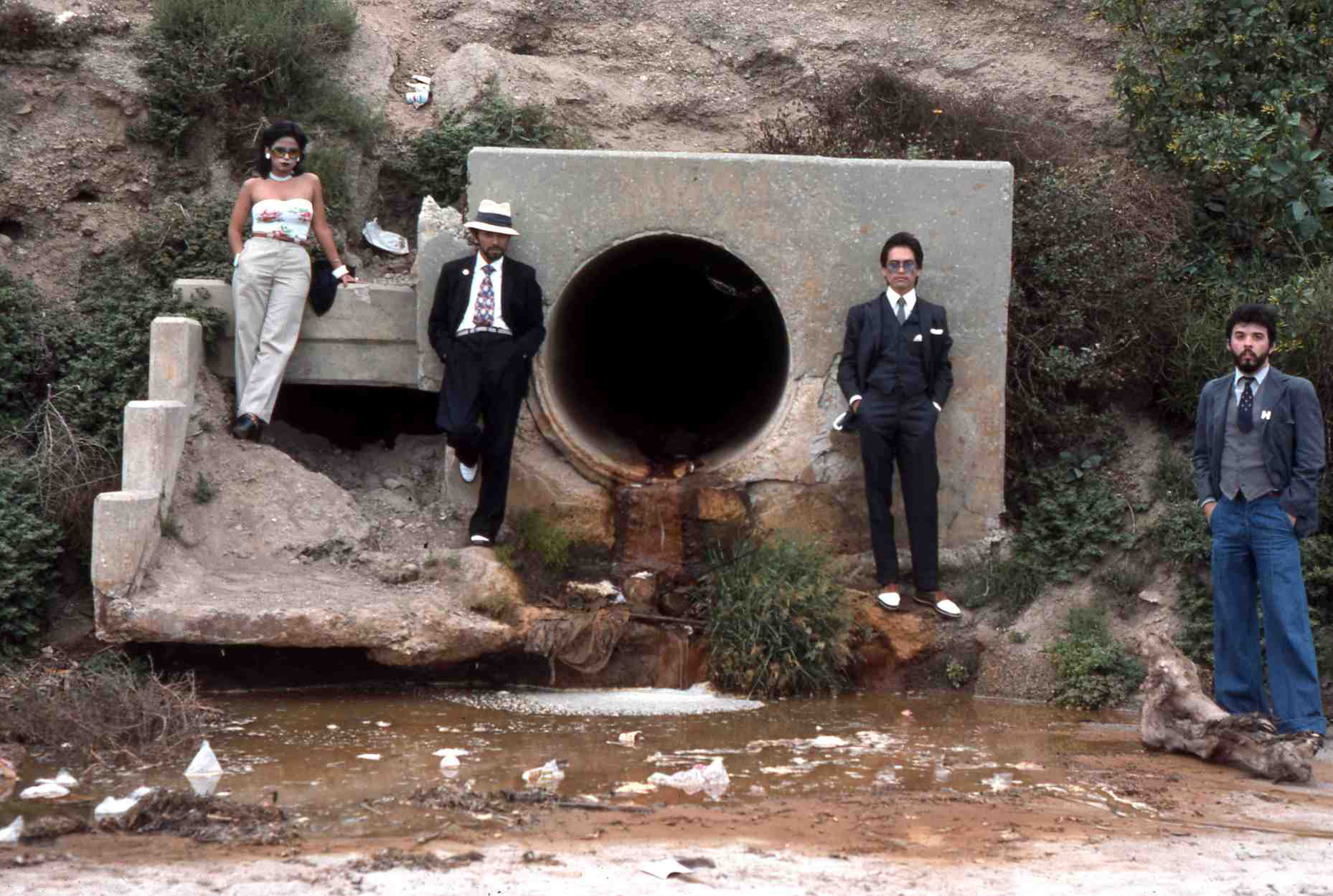 Asco, <em>Asshole Mural</em>, 1974. Colour photograph. Photograph: Harry Gamboa, Jr, showing Patssi Valdez, Humberto Sandoval, Willie Herrón III and Gronk.