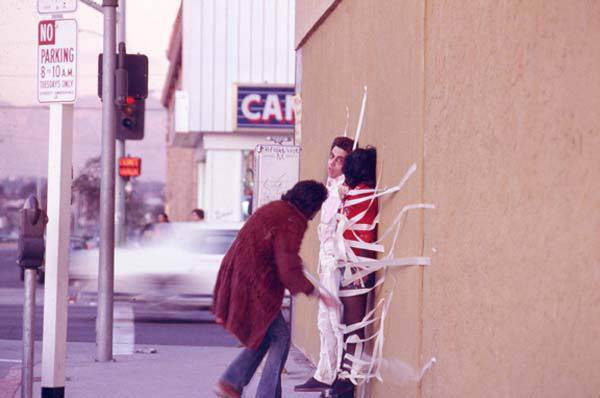 Asco, <em>Instant Mural</em>, 1972. Performance. Pictured: Gronk, Patssi Valdez, and Humberto Sandoval. Photo: Harry Gamboa, Jr. Courtesy the artists.