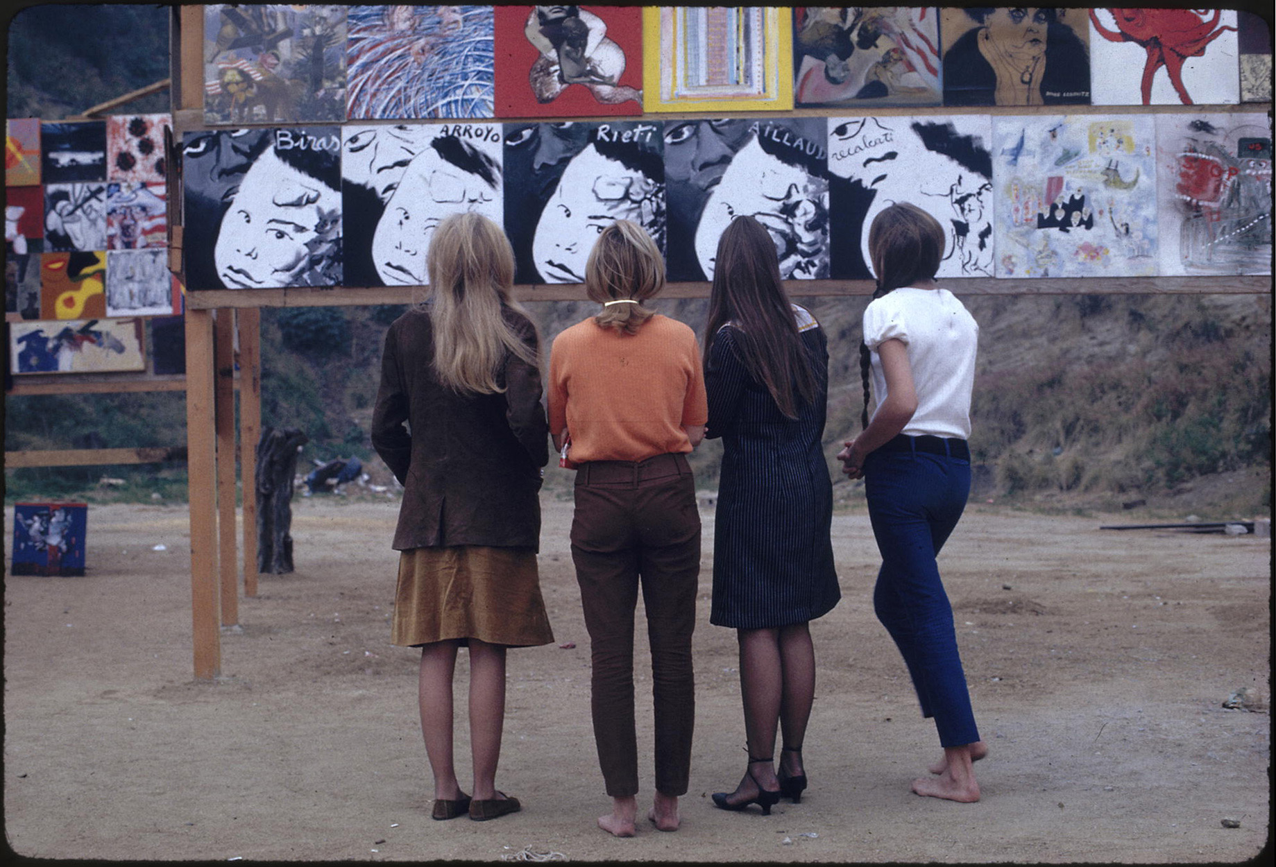 Four women looking at art work at the <i>The Artists’ Tower of Protest</i>, 1966. Charles Brittin Archive, The Getty Research Institute, Los Angeles, (2005.M.11). Photo: Charles Brittin. © J. Paul Getty Trust.